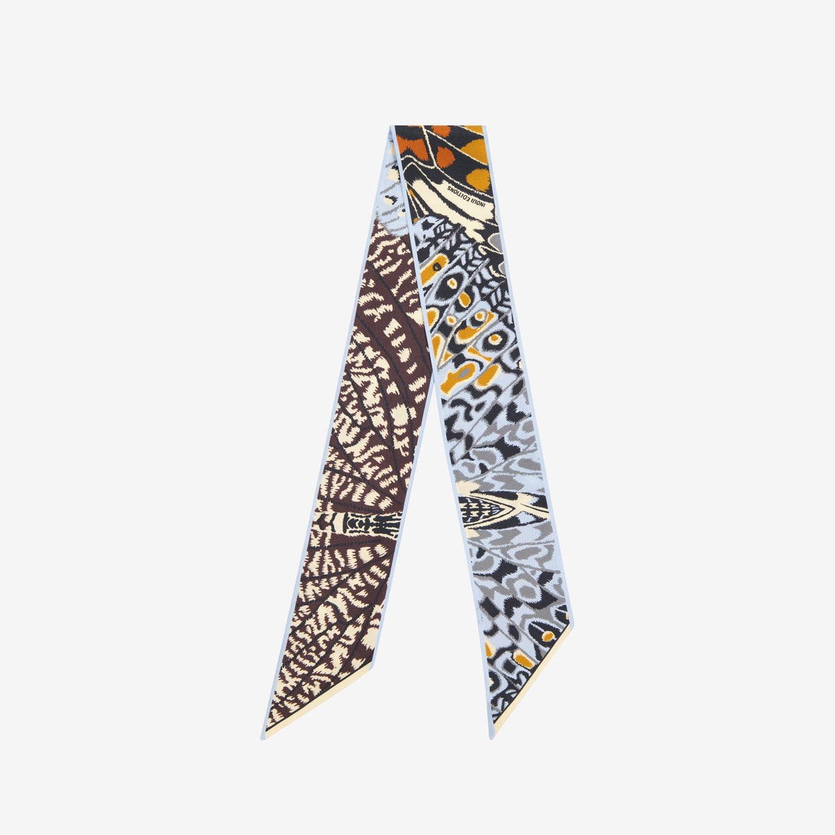 The INOUI EDITIONS - PAPILLON (BUTTERFLIES) SILK RIBBON by INOUI is a double-sided, narrow silk scarf featuring a brown, beige, and cream abstract pattern on one side and a blue, yellow, and gray geometric design on the other.