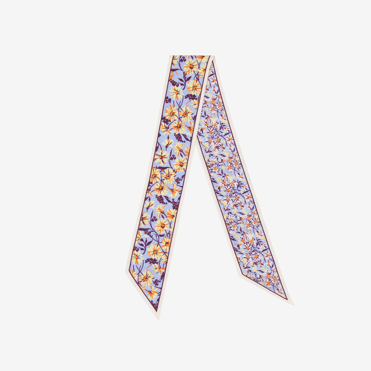 The INOUI EDITIONS - FAUST SILK RIBBON IN PASTEL by INOUI is a pastel silk lavaliere with a colorful floral print on light purple, bordered in dark purple. Its long, narrow design forms a stylish V on a white background.