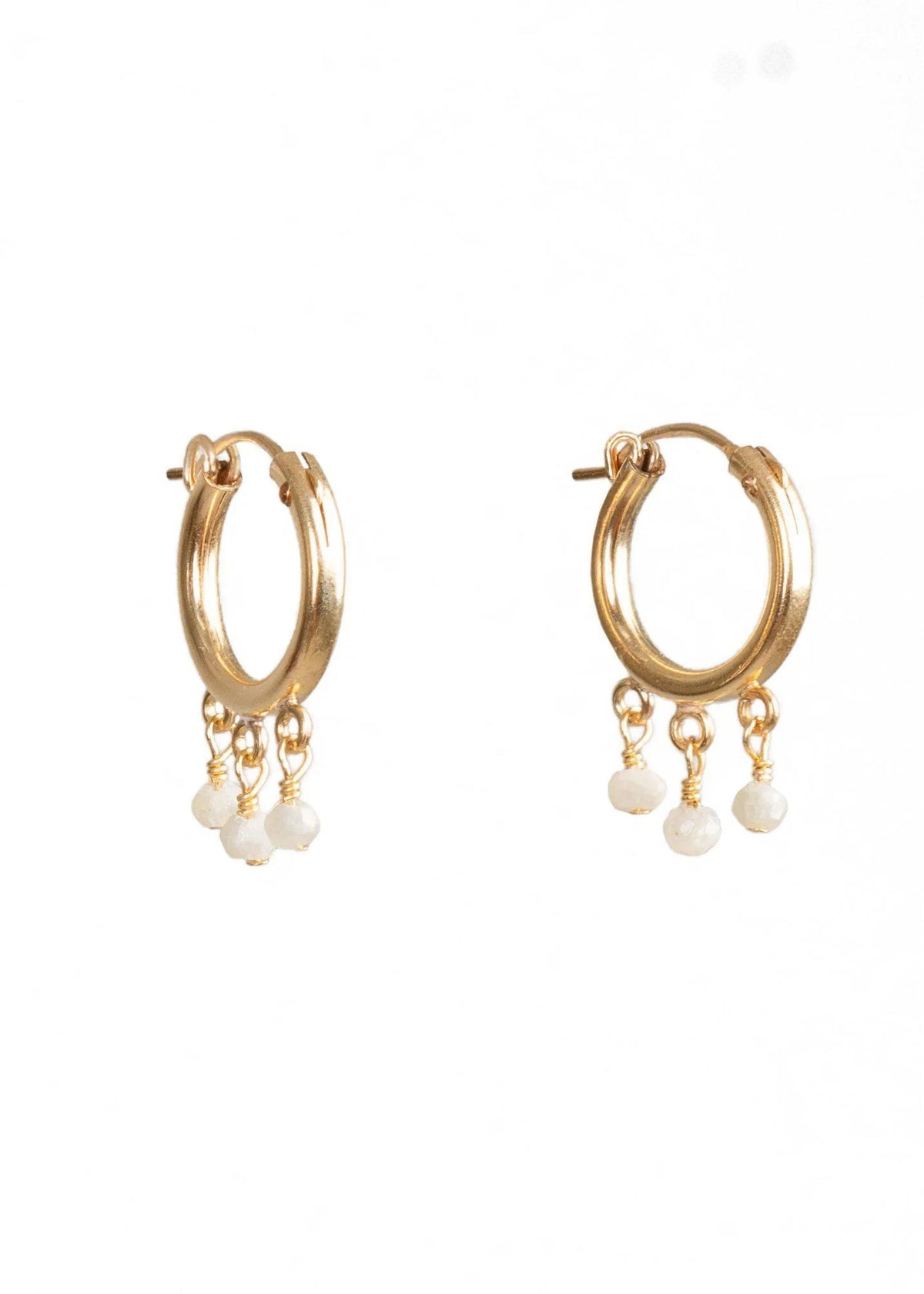 GOLDISH - FRINGE HOOP EARRINGS WITH WHITE PEARLS by GOLDISH: small gold fill hoops featuring three dangling white pearl charms, shown on a plain white background.