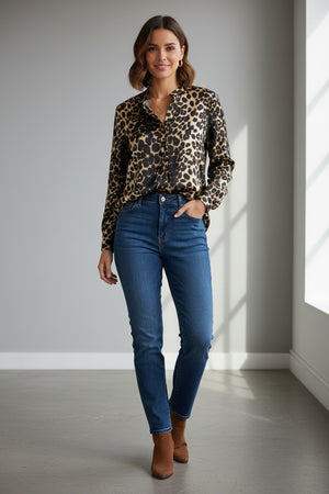 The 0039 ITALY - ALISAR BLOUSE showcases an elegant stand-up collar and long sleeves, highlighted by a striking black and tan leopard print, beautifully set against a plain gray background.