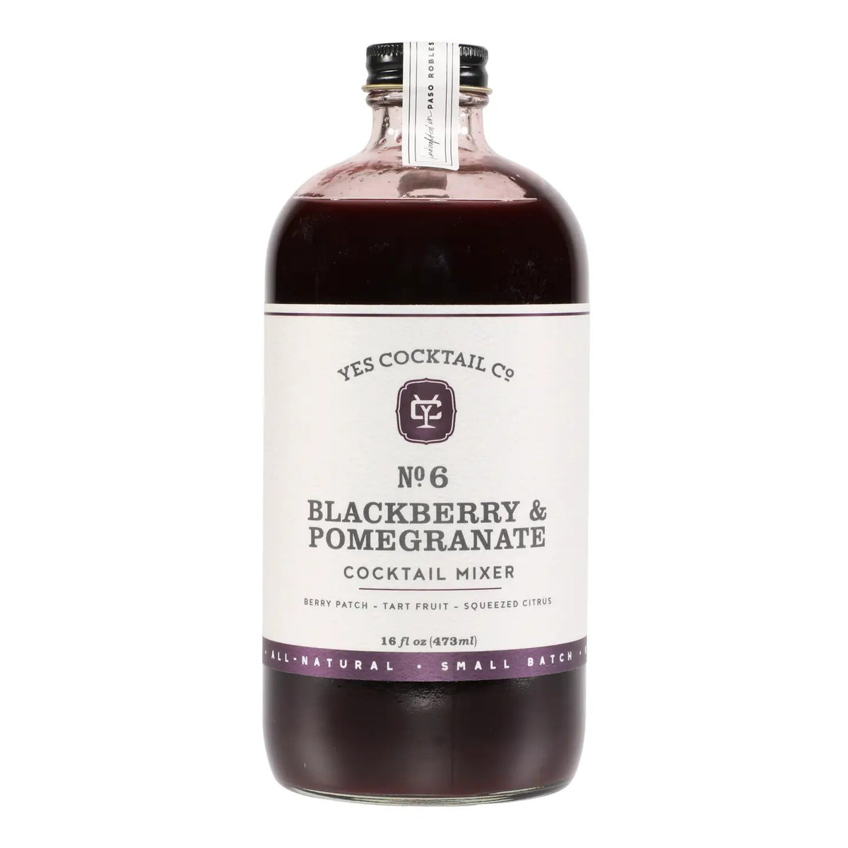 A 16 fl oz glass bottle of YES COCKTAIL CO - BLACKBERRY POMEGRANATE MIXER, from YES COCKTAIL CO., featuring a purple liquid and a white label with black text and minimalist graphics—ideal for crafting drinks with this all-natural cocktail mixer.