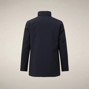 A man wears a dark blue SAVE THE DUCK - BLAISE JACKET IN BLUE BLACK with a high neck and a zippered chest pocket.