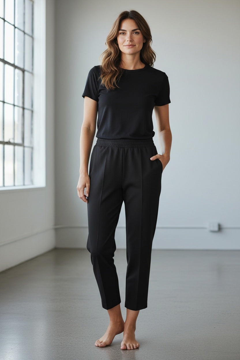 The MEIMEIJ - PONTE PULL ON TROUSER by MEIMEIJ is a pair of light beige, straight-leg trousers with an elastic waistband and side pockets, shown on a plain white background.