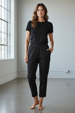 The MEIMEIJ - PONTE PULL ON TROUSER by MEIMEIJ is a pair of light beige, straight-leg trousers with an elastic waistband and side pockets, shown on a plain white background.