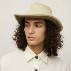 The TILLEY AIRFLO Broad Brim Hat LTM6 in Khaki Olive features mesh ventilation around the crown for outdoor use. Shown on a plain light background, this wide-brimmed sun protection hat is crafted by TILLEY.