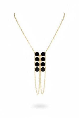 The GOLDISH DOUBLE LADDERS TO BLISS BLACK ONYX CIRCLE STONE NECKLACE, featuring three vertical rows of black onyx stones, is shown on a beige fabric bust stand against a white background.