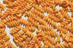 KAIZEN FOOD COMPANY's KAIZEN - FUSILLI features a blue and green box with a window showing the pasta. The plant-based, gluten-free, low-carb fusilli offers 19g protein, 2g net carbs, and 17g fiber per serving.