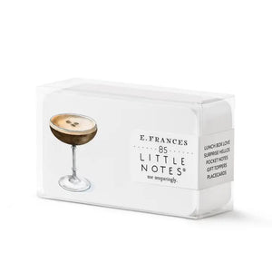 E. FRANCES - LITTLE NOTES ESPRESSO MARTINI by E. FRANCES PAPER: a stack of small notecards featuring an espresso martini illustration front and coffee beans back—perfect stationery for cocktail lovers—with a yellow pencil for scale.