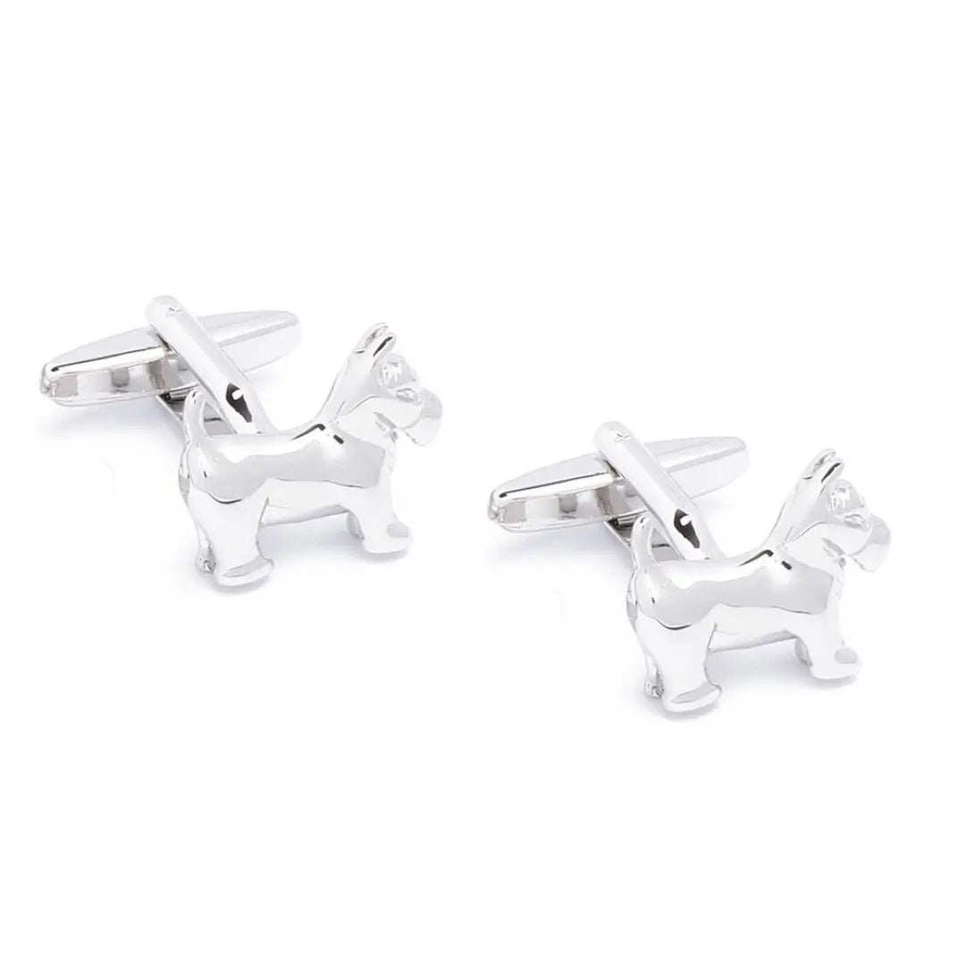 STOLEN RICHES - DOG CUFFLINKS: Shiny silver men’s cufflinks shaped like small dogs by STOLEN RICHES, displayed on a white background—unique accessories and a perfect gift for men.