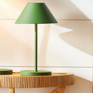 The NAPA HOME AND GARDEN - ALLUNA 10” Cordless LED Lamp in green, a compact and modern luxury table lamp featuring a metal conical shade and a round base, is displayed against a plain white background.