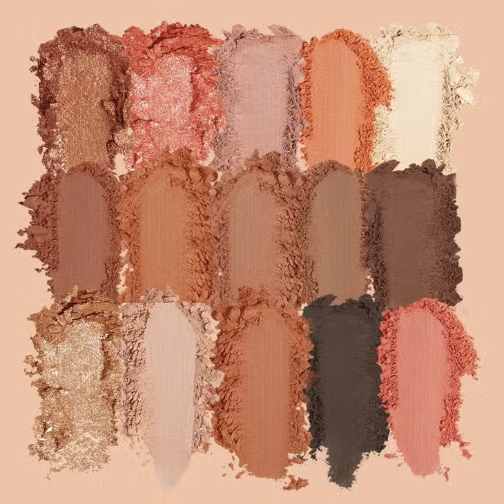 The JASON WU BEAUTY FLORA 15 EYESHADOW is a large, rectangular shadow palette that features 15 vibrant shades. It includes a variety of matte, shimmer, and metallic finishes in tones ranging from neutrals to bold colors like peach and pink. The name &#39;JASON WU&#39; is printed inside the palette.