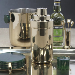 The ZODAX SPIGA COCKTAIL SHAKER - GREEN ACCENTS features a gold metallic premium alloy body with a shiny finish and dark green cap, shown standing upright against a white background.