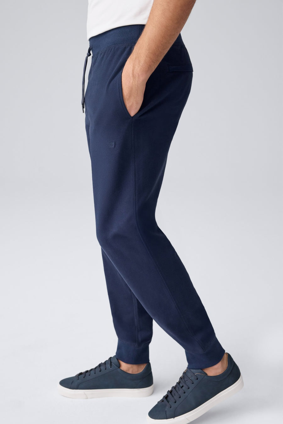 The MACK WELDON Ace Relaxed Fit Sweatpants in True Navy - Bird’s Eye feature a soft, slightly heathered French terry fabric, elastic waistband with drawstring, ribbed cuffs, relaxed fit, and a small embroidered logo on the left thigh.