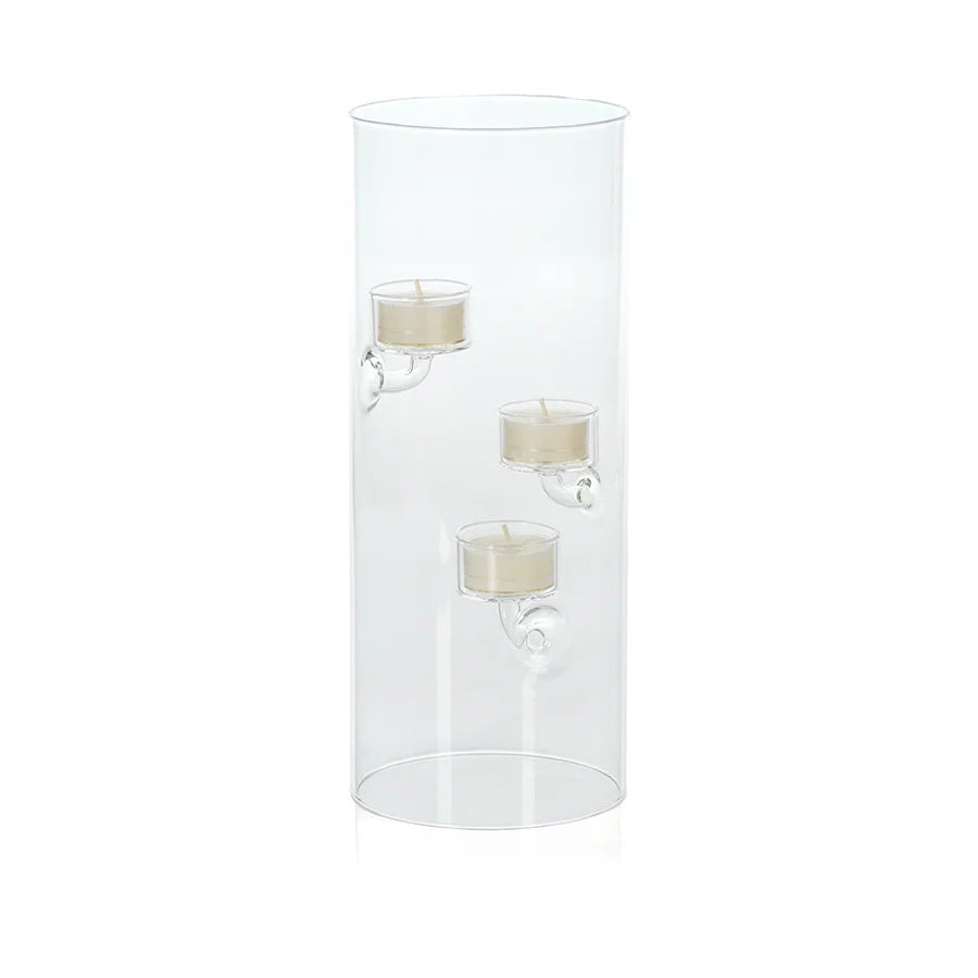 Five ZODAX SUSPENDED GLASS TEALIGHT HOLDER - EXTRA LARGE candle holders with floating tealights are arranged on a gray surface, with driftwood in the background. The windproof holders vary in height for an elegant display.