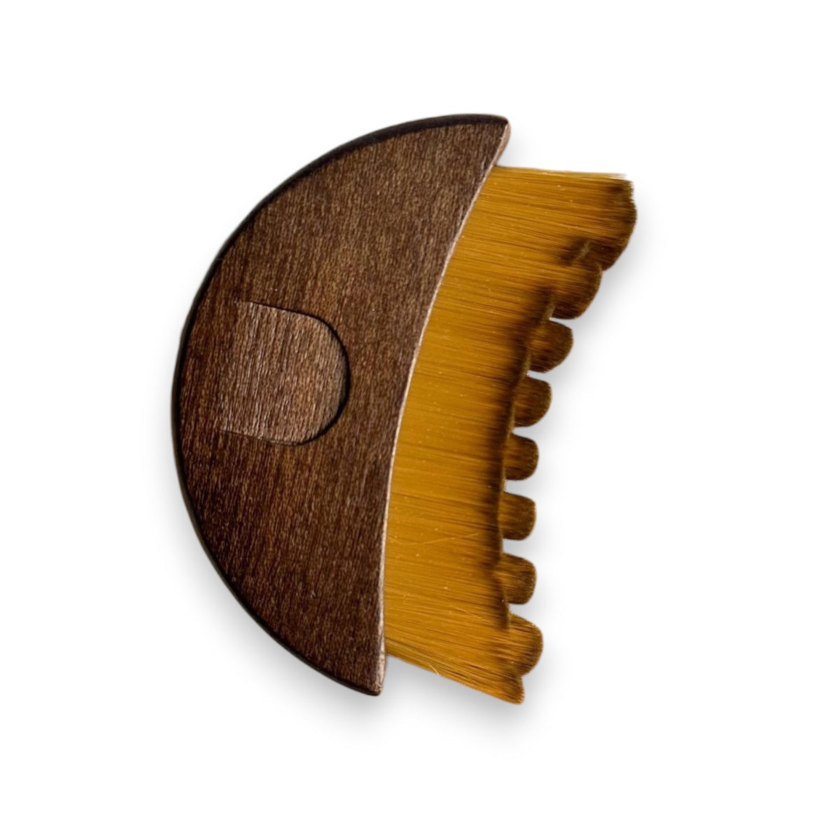 A SMILE BOUTIQUES LYMPHATIC BRUSH WITH NATURAL WOOD, featuring soft bristles, is displayed next to a satin drawstring pouch and brown paper packing material on a white surface. This elegantly designed facial massage brush is crafted from premium natural wood, making it a luxurious addition to your skincare routine.