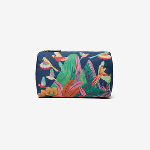 The INOUI EDITIONS - RIO NYLON CASE, MEDIUM by INOUI is a zippered pouch featuring a vibrant Rio illustration with colorful birds and lush greenery on a dark blue background. Birds in various flying poses bring dynamic movement to this chic travel accessory.