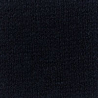 A smiling woman stands against a white background, wearing the KINROSS CASHMERE Thermal Lurez Stripe Crew Neck Sweater in black and light blue jeans.