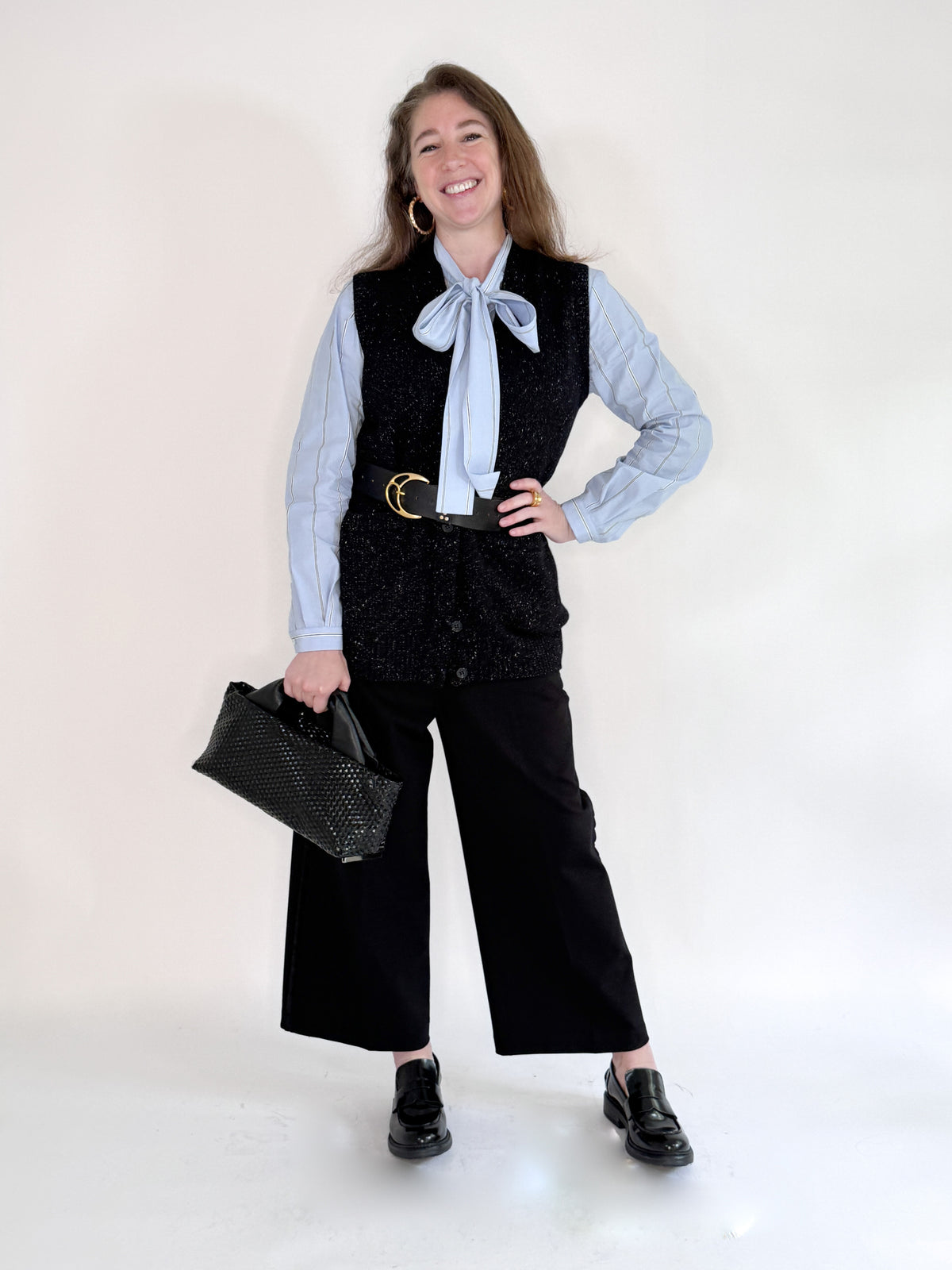 The SEVENTY VENEZIA - BLUE STRIPE SHIRT by SEVENTY features thin white vertical stripes, a chic bow tie collar, and an elegant high neck.