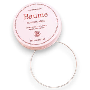 A round, pink tin of MANUCURIST - ROSE BALM COSMOS ORGANIC NATURAL NOURISHING BALM from MANUCURIST INC with the lid slightly ajar to reveal the balm inside. The label notes its versatility for hands, nails, and lips—making it an ideal nourishing cuticle balm and lip repair treatment that easily integrates into your natural skincare routine.