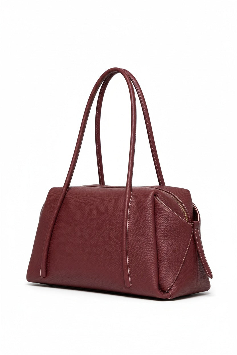 Deep red OLIVEVE - SOLARA SATCHEL IN BAROLO ITALIAN BUFFALO COWHIDE, a rectangular bag featuring long shoulder straps and a top zipper closure.