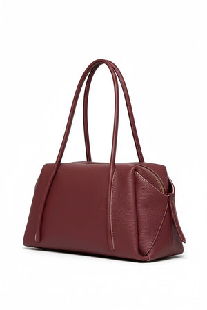 Deep red OLIVEVE - SOLARA SATCHEL IN BAROLO ITALIAN BUFFALO COWHIDE, a rectangular bag featuring long shoulder straps and a top zipper closure.