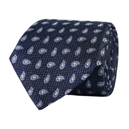 Elevate your business attire with the AMANDA CHRISTENSEN - PAISLEY JACQUARD WOVEN SILK TIE IN NAVY MELANGE. Featuring an elegant paisley pattern in light blue on a refined navy mélange background, this sophisticated silk tie is an essential accessory for the modern gentleman. Displayed rolled-up against a crisp white background, it seamlessly blends timeless style and professionalism—making it a standout piece from AMANDA CHRISTENSEN’s collection.
