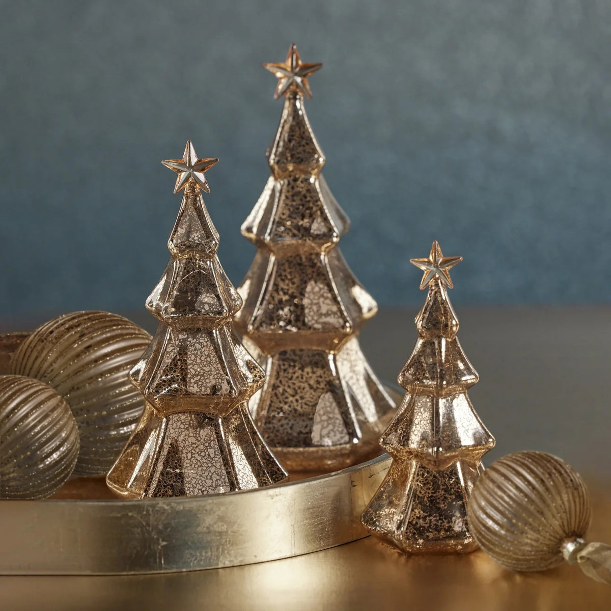 ZODAX LED HEXAGON ANTIQUE TREE WITH STAR DESIGN, a metallic, hexagonal-shaped Christmas tree ornament with a mercury glass finish, integrated LED light, and a star topper.
