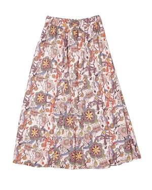 The Lulu Skirt by THE LITTLE PROJECT features a vibrant Liberty of London Cirque print with animals and floral designs in orange, purple, green, and yellow on an off-white base. Its elastic waist offers comfort and style.