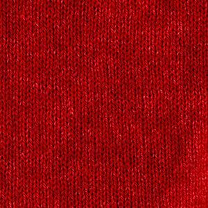 Close-up of a warm, rusty orange knitted fabric showcasing the even stockinette stitch texture of the BASE MILANO - BOXY OVERSIZED V NECK SWEATER by BASE MILANO.