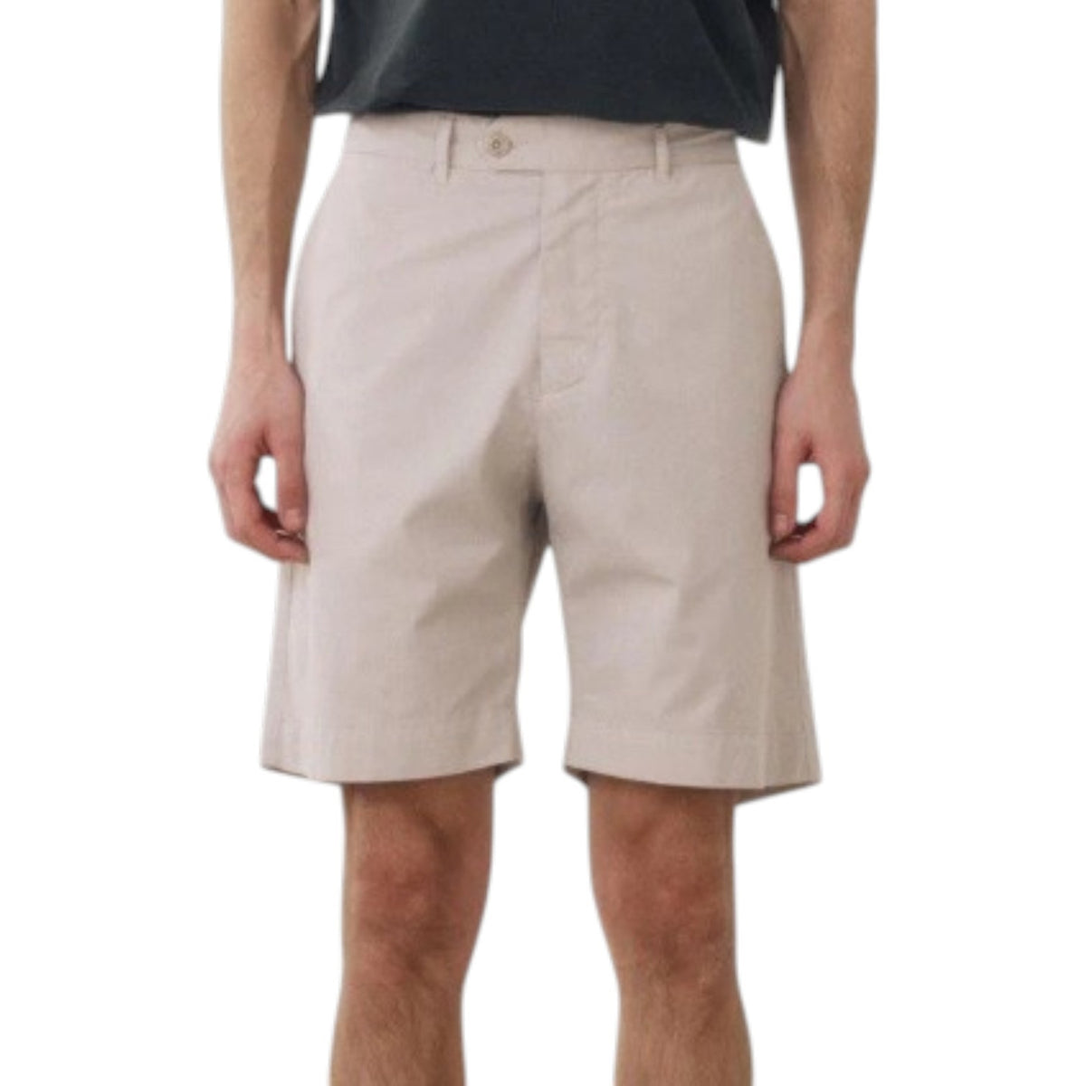 A person models the HARTFORD - TAYLOR SHORTS IN STONE by HARTFORD, shown in light beige against a plain white background. The image is cropped to display only the lower torso and legs.