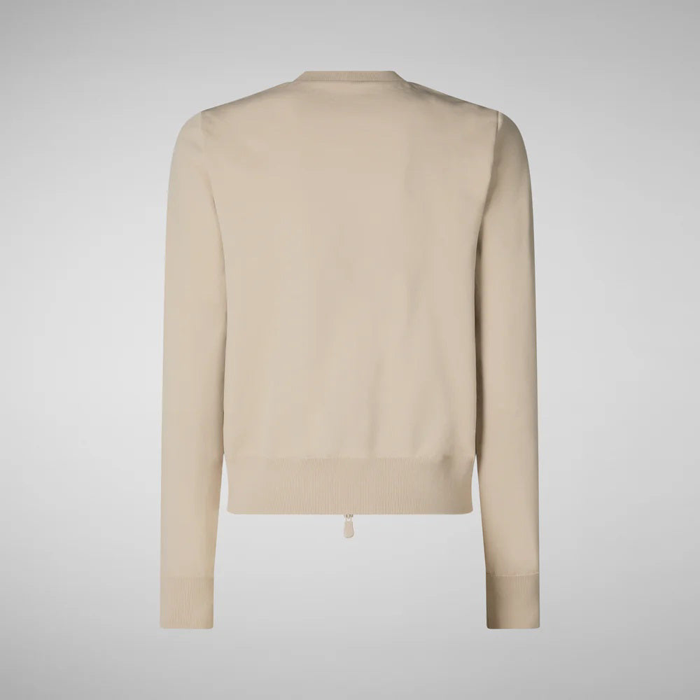 The cream SAVE THE DUCK BRIONY HYBRID PUFFER JACKET is a stylish summer layering piece with a quilted front, smooth sleeves, front zipper, and two buttoned pockets, blending sporty elegance effortlessly.