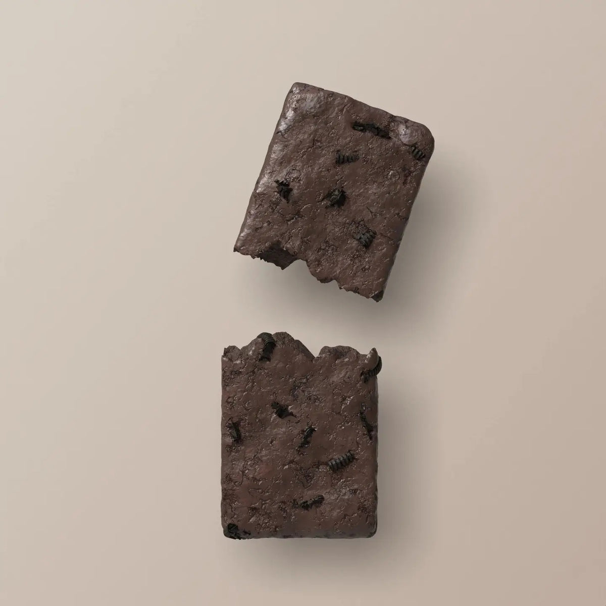 A STARS+HONEY - MINT COOKIES & CREAM Collagen Protein Bar, with its wrapper, displays mint chocolate ice cream and cookie pieces bursting out for a dynamic effect against a beige background.