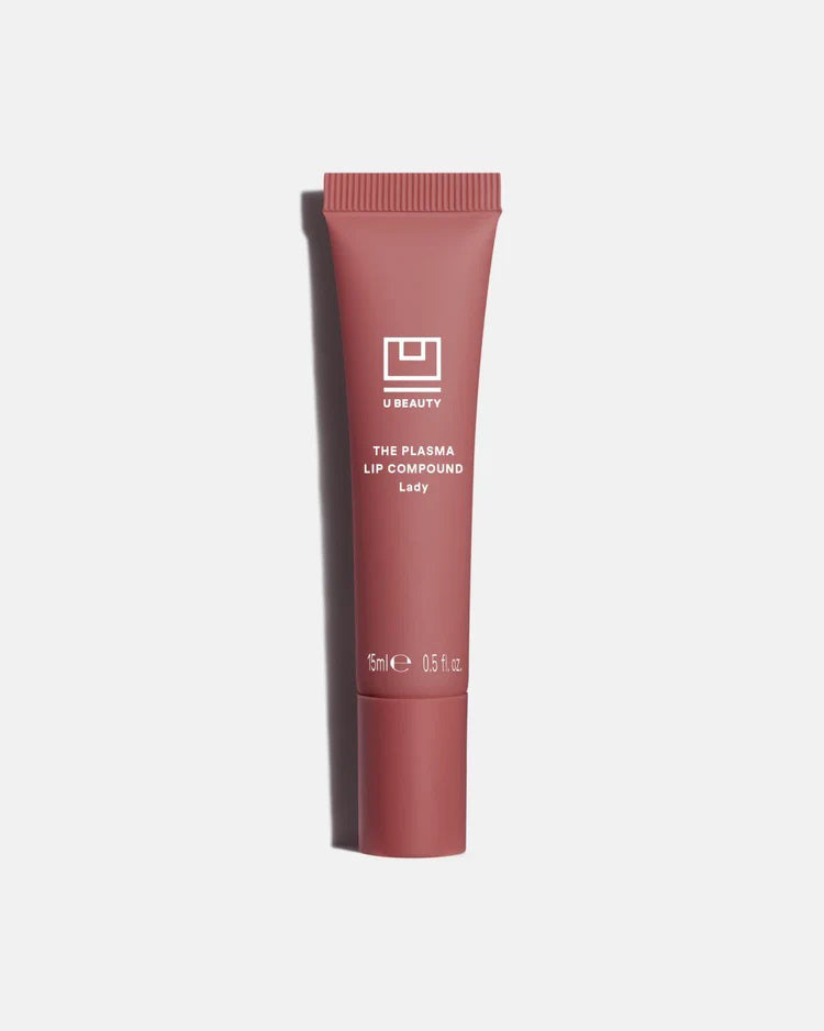 A light gray tube of U BEAUTY THE PLASMA LIP COMPOUND 15ML stands upright with white text and logo, highlighting this hydrating lip treatment and plumper against a white background.