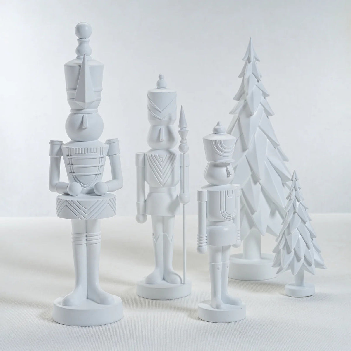 The ZODAX MATTE RESIN SOLDIER - LARGE is a white, stylized decorative figure crafted from resin, shown upright on a reflective surface against a plain background. Dimensions: 5.25 in x 15 in (13.34 cm x 38.1 cm).