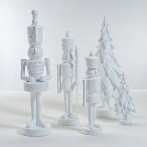 The ZODAX MATTE RESIN SOLDIER - LARGE is a white, stylized decorative figure crafted from resin, shown upright on a reflective surface against a plain background. Dimensions: 5.25 in x 15 in (13.34 cm x 38.1 cm).