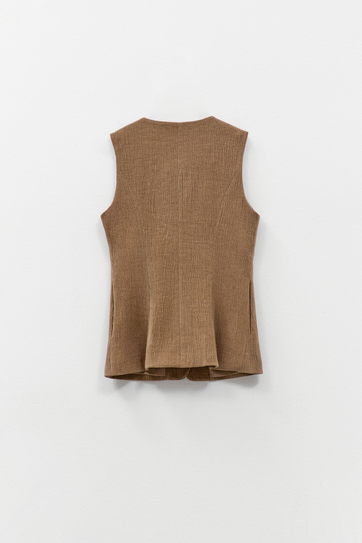ELEH - THE ATLIER VEST by ELEH: A sleeveless, textured brown crinkle fabric vest with a round neckline and small front buttons, shown against a white background.