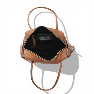OLIVEVE Solara Satchel in caramel Italian buffalo cowhide leather with long shoulder straps and a top zipper closure.