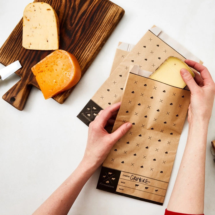 A white box labeled "FORMATICUM - CHEESE STORAGE BAGS" with cow, goat, and sheep icons. Includes 15 bags (6.25 x 11 in) for cheese storage at home; info available in multiple languages.