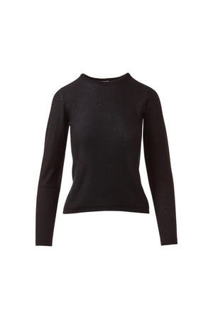 A woman stands facing forward, smiling softly with her hands by her sides, wearing the KINROSS CASHMERE Sequin Crew Neck Sweater in light gray and black pants against a plain white background.