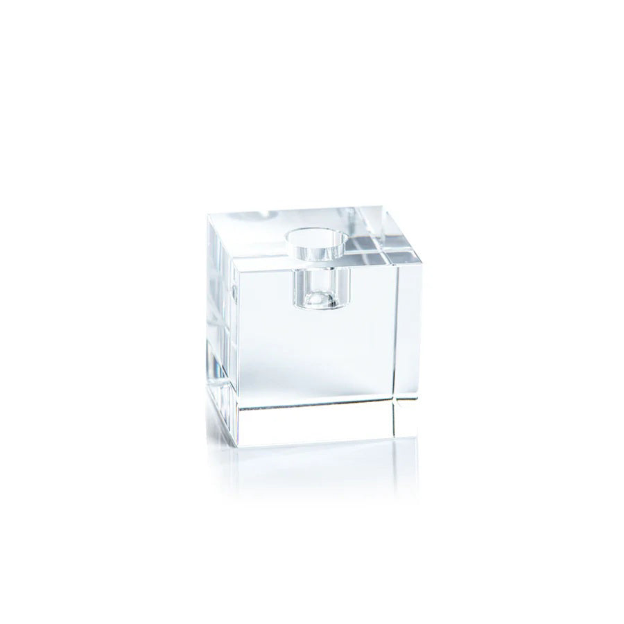 The ZODAX SQUARE CRYSTAL GLASS TAPER HOLDER 2.75&quot; is a sleek glass decor piece with smooth, sharp edges and a circular top opening, shown against a white background. Its clear crystal design adds a striking, reflective touch to any setting.