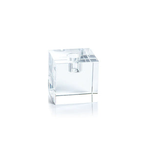 The ZODAX SQUARE CRYSTAL GLASS TAPER HOLDER 2.75" is a sleek glass decor piece with smooth, sharp edges and a circular top opening, shown against a white background. Its clear crystal design adds a striking, reflective touch to any setting.