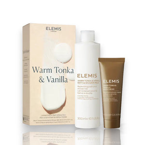 A beige box with the ELEMIS - STEINER logo at the top and "Warm Tonka & Vanilla" written below in large text. The bottom of the box mentions "Limited Edition Body Duo." The box features an abstract white paint design in the background, evoking a touch of British wilderness.