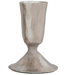 The CREATIVE COOP HAND-FORGED CAST IRON TAPER HOLDERS feature textured surfaces, wide bases, and rustic, handmade appeal in antique brass and silver finishes.
