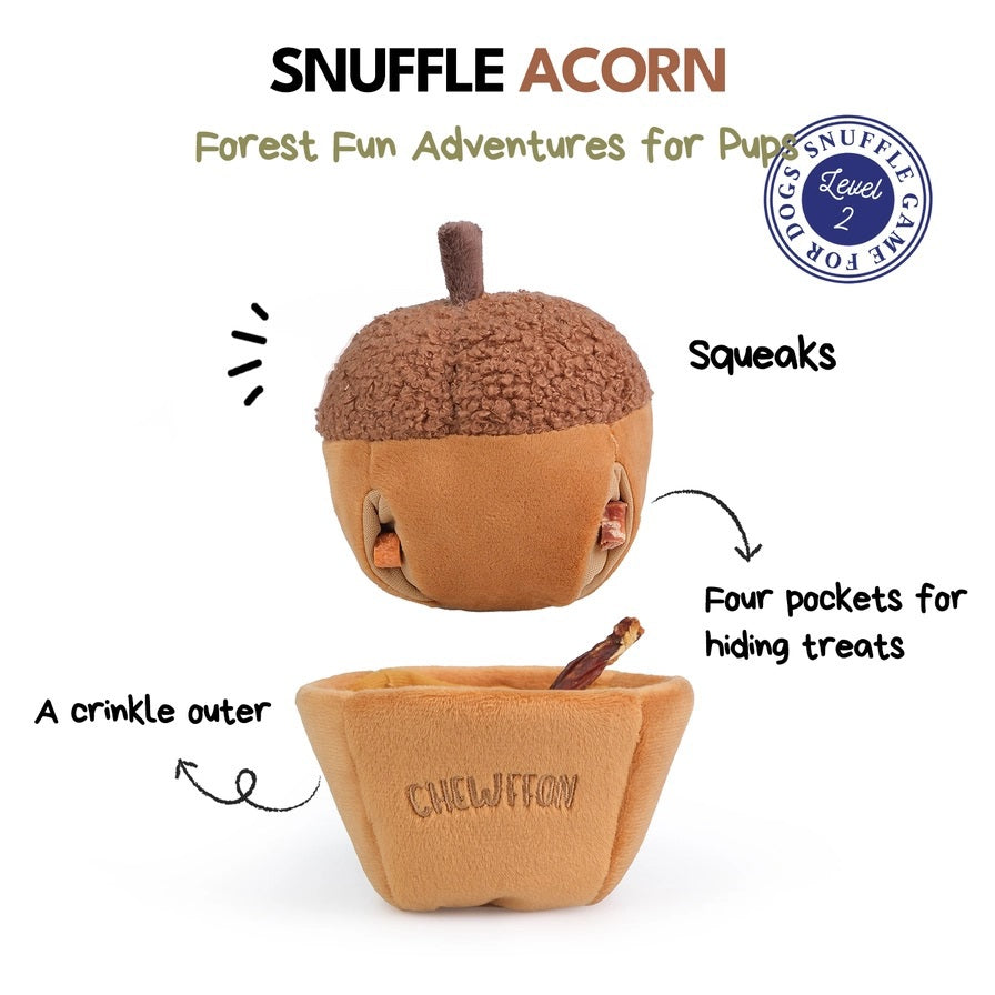 A plush, squeaky dog toy from CHEWFFON shaped like an acorn, featuring a textured brown top and a smooth tan base. The word “CHEWFFON” is embroidered on the base in light brown thread. This toy is called the ACORN SNUFFLE &amp; SQUEAKY DOG TOY.