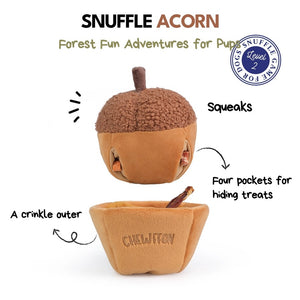 A plush, squeaky dog toy from CHEWFFON shaped like an acorn, featuring a textured brown top and a smooth tan base. The word “CHEWFFON” is embroidered on the base in light brown thread. This toy is called the ACORN SNUFFLE & SQUEAKY DOG TOY.