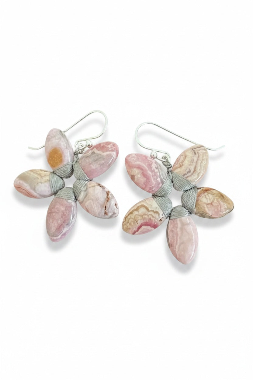 ANN LIGHTFOOT - RHODONITE FLOWER EARRINGS feature five pink and beige patterned petals with sterling silver wire wrapping, shown on a white background—ideal for fans of handmade gemstone jewelry by ANN LIGHTFOOT.