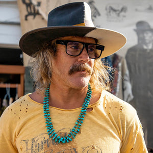 A pair of CADDIS - MISTER CARTOON READERS rectangular black eyeglasses with a premium acetate frame, “CADDIS” on the left arm and “1.50” on the right lens, shown against a white background.