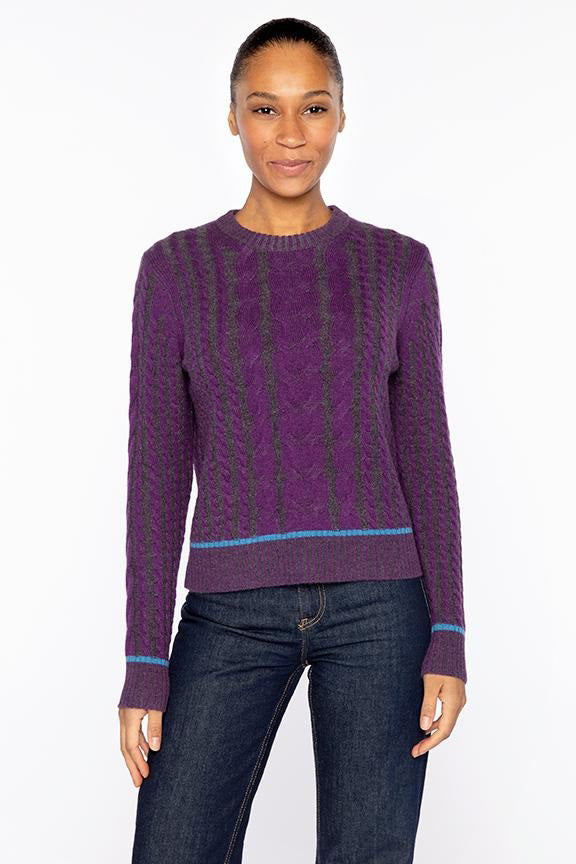 The KINROSS Plaited Tipped Cable Crew Neck Cashmere Sweater features a light pink 100% cashmere cable-knit design with long sleeves and ribbed cuffs and hem, shown on a white background.