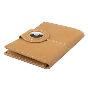 The GARZINI RFID-blocking leather passport holder in camel brown features white stitching and a circular front compartment for an Apple AirTag.