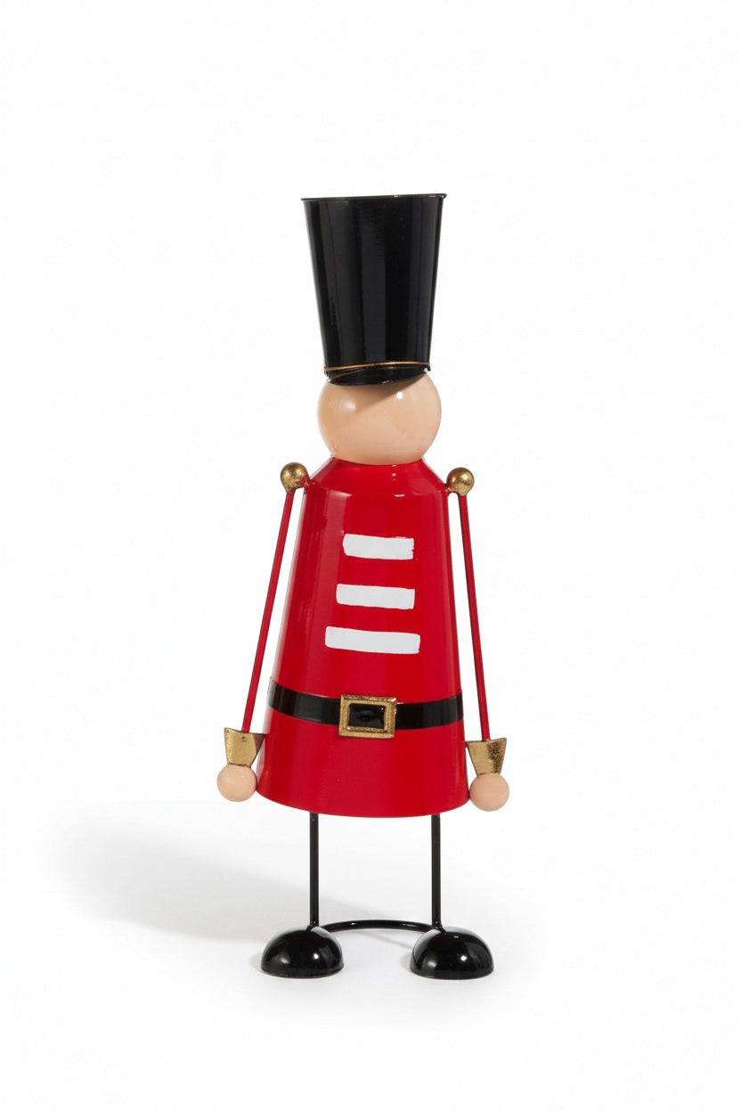 A large RED, WHITE AND BLACK NUTCRACKER by RAZ IMPORTS, featuring a decorative metal figure wearing a tall black hat, a red coat with white stripes, and a black belt.